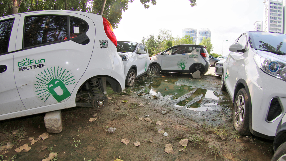 Schrottplatz für Elektroautos aus dem Carsharing in China